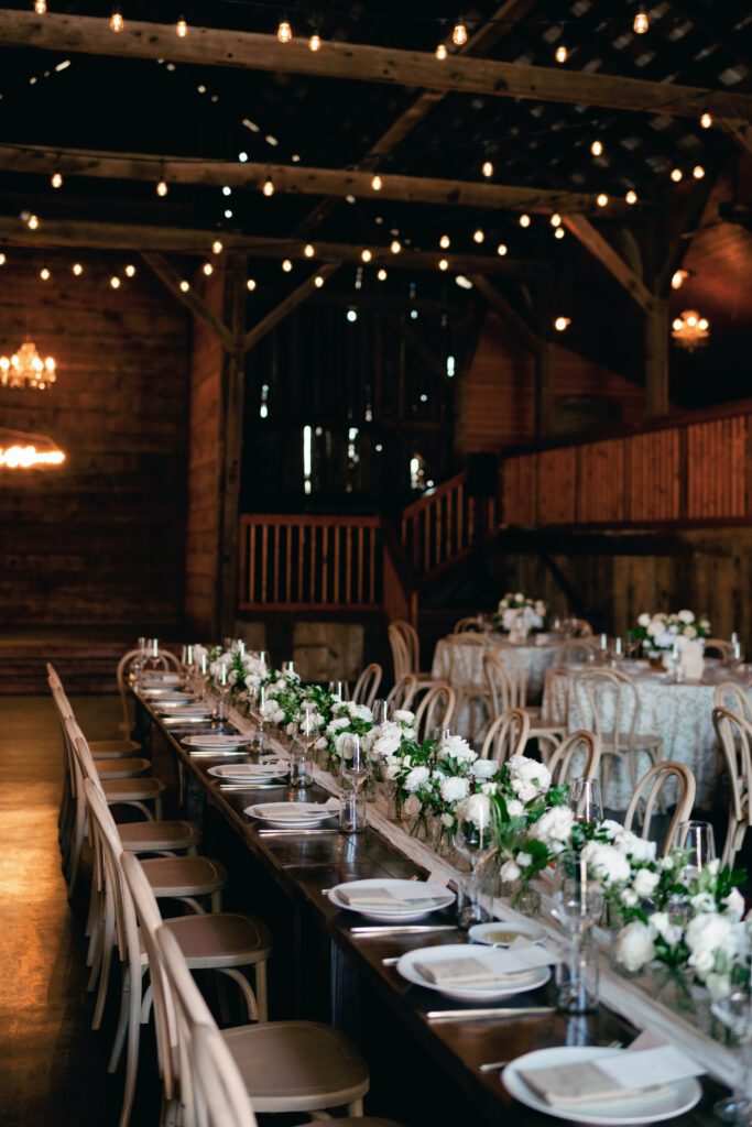 table scapes and details of the reception space, white florals and greens with overhead lighting and pattern table cloths olympias valley estate in petaluma california, wedding photography by alyssa gayle photography based in san francisco california and traveling worldwide