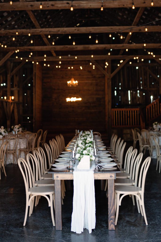 table scapes and details of the reception space, white florals and greens with overhead lighting and pattern table cloths olympias valley estate in petaluma california, wedding photography by alyssa gayle photography based in san francisco california and traveling worldwide