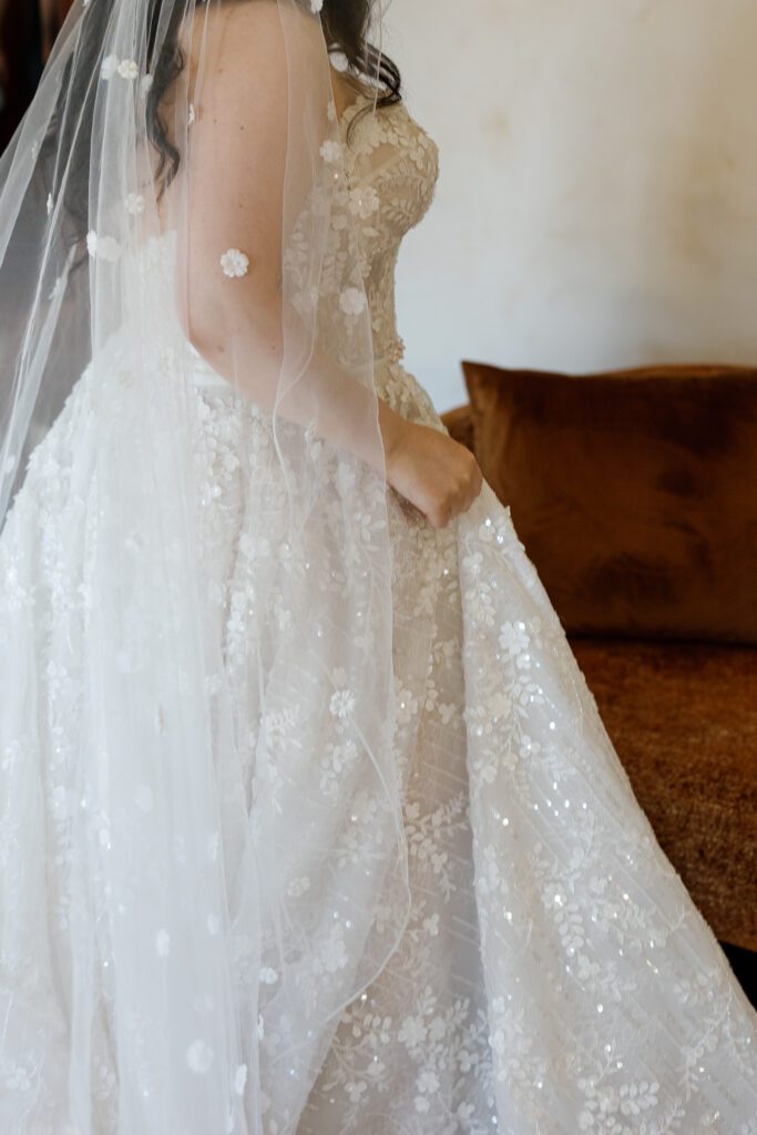 Bride wearing lace wedding dress during Sonoma winery wedding at Jacuzzi Winery
